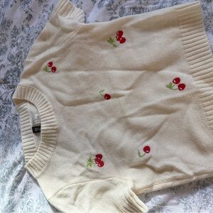 Divided Cream Sweater with Red Cherry Accents